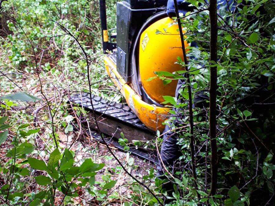 Excavator successfully recovered from woodland